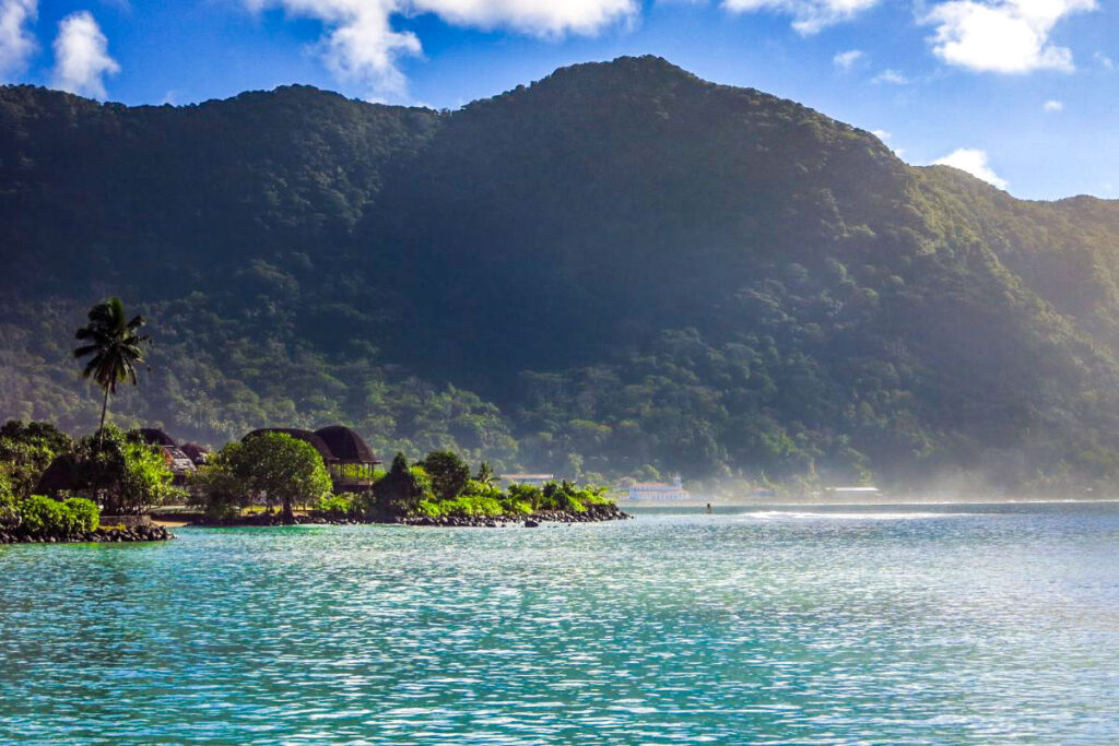 Top 7 Unique Travel Destinations to Visit in 2025 Samoa's pristine blue waters and lush green mountains and landscapes on the coastline